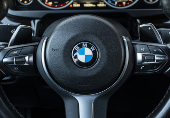 Подержанный автомобиль BMW X6 2016 года (11 фото)