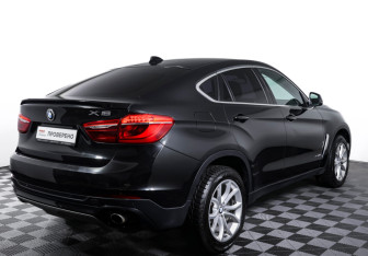 Подержанный автомобиль BMW X6 2015 года (5 фото)