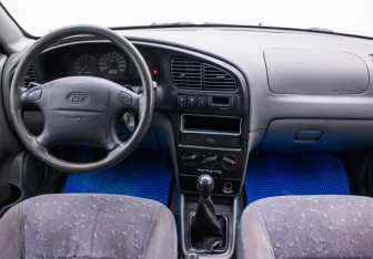 Подержанный автомобиль Kia Spectra Sedan 2006 года (13 фото)