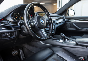 Подержанный автомобиль BMW X6 2016 года (9 фото)