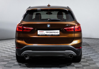 Подержанный автомобиль BMW X1 2015 года (6 фото)