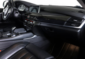 Подержанный автомобиль BMW X6 2016 года (10 фото)