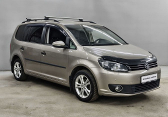 Подержанный автомобиль Volkswagen Touran 2013 года (3 фото)