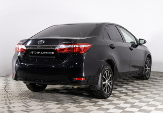 Подержанный автомобиль Toyota Corolla Sedan 2014 года (3 фото)