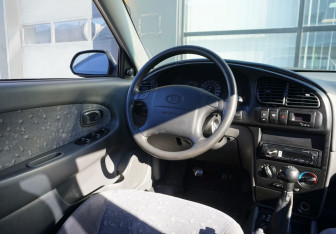 Подержанный автомобиль Kia Spectra Sedan 2009 года (13 фото)