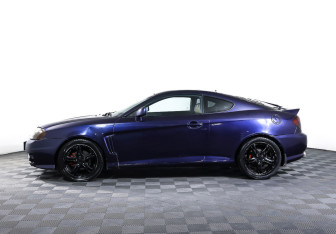 Подержанный автомобиль Hyundai Coupe 2002 года (8 фото)